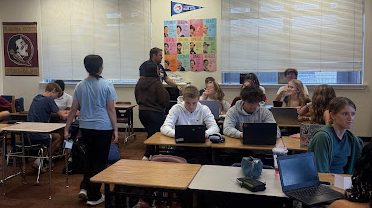 Students in AP Seminar work to analyze information under the direction of teacher Lee Cameron. AP Seminar is one of the many AP courses offered on campus.