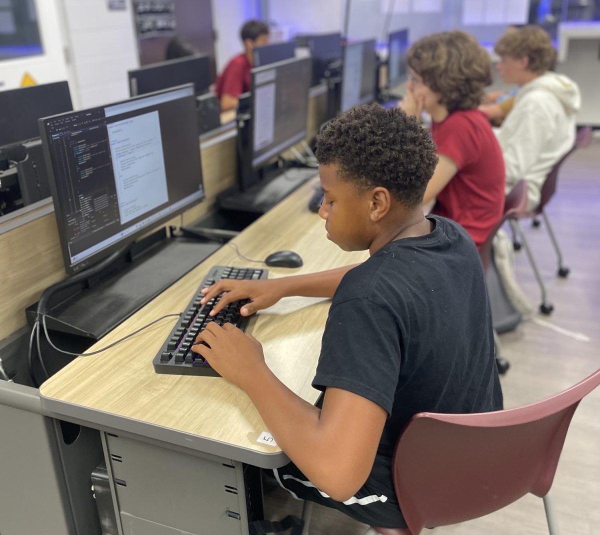 Freshman Jaeden Jackon works on assignments in his computer science class. Freshmen like Jackson have had to adjust to different expectations and class styles.