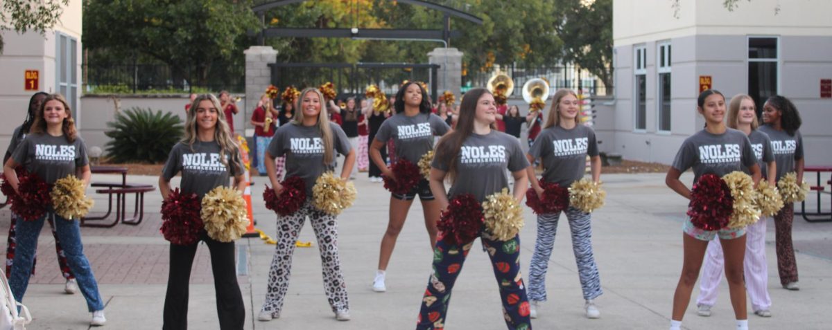 The varsity cheer team performed several routines at the Monday pep rally.