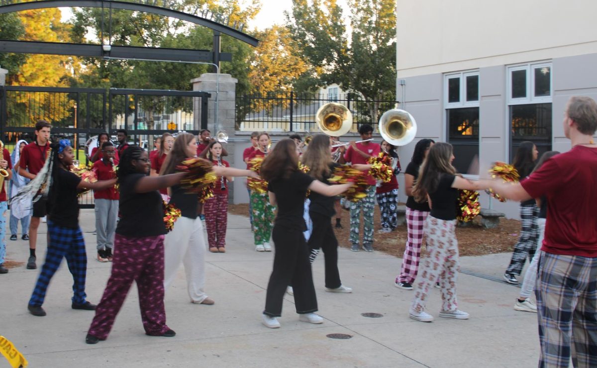 The Marching Braves lead the school spirit at the Monday morning pep rally.