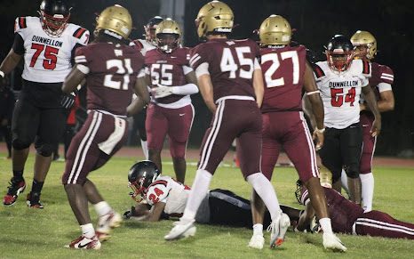 Izayah Vickers, Mekhi Thelwell, Caleb Alkema and Leevan Sands (from left to right) celebrate stopping the Dunnelion ball carrier. The Dunnelion game was the first of three home games.
Photo courtesy of The Renegade.