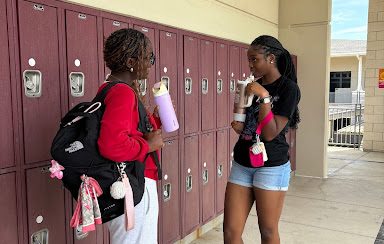 Freshman Megan Esellem and Sanaa Harris show off their back-to-school fits. Not only do they follow the appropriate dress code, but they also keep it trendy and stylish. 