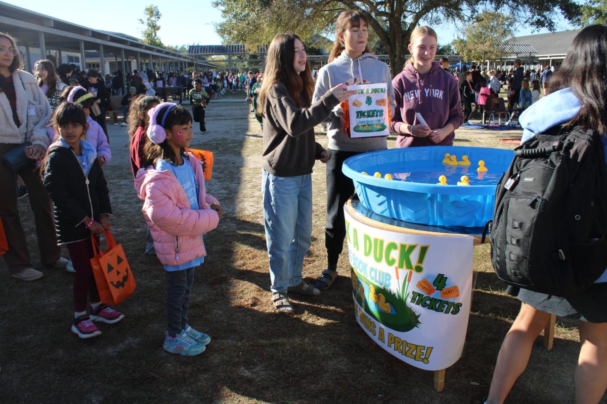 Book Club hosted the Pluck A Duck booth. 