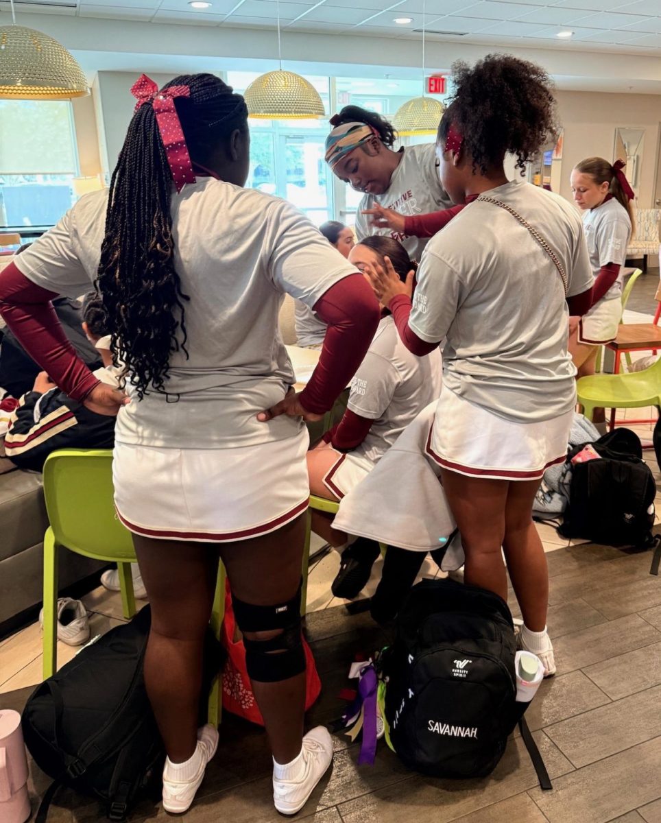 Freshmen Kaiden Jenkins and Savannah Dawkins get ready for a cheer competition. Photo courtesy of Savannah Dawkins.
