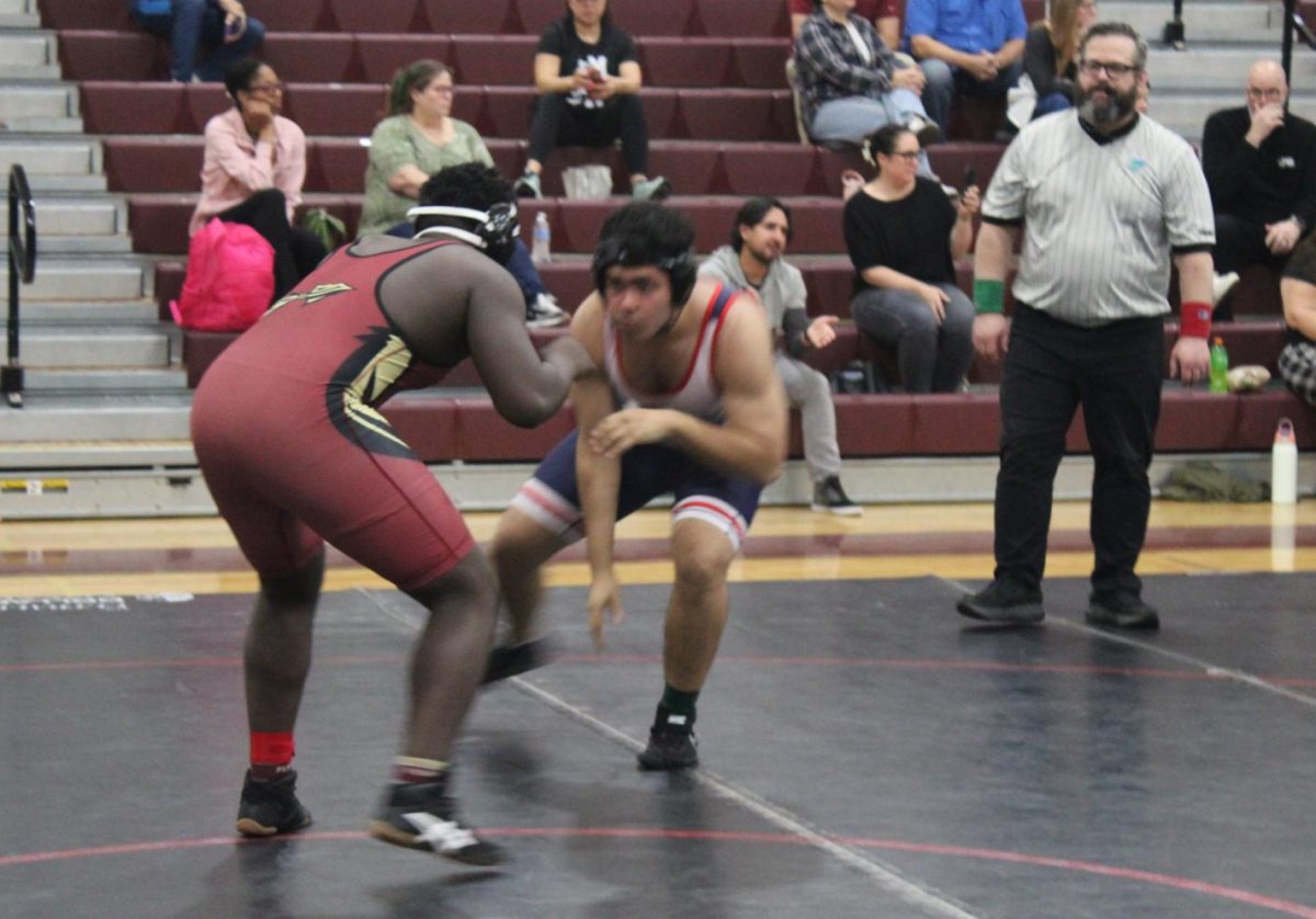 Junior Mekhi Thelwell (on left) and his opponent from Wakulla look for an opening to make a move.