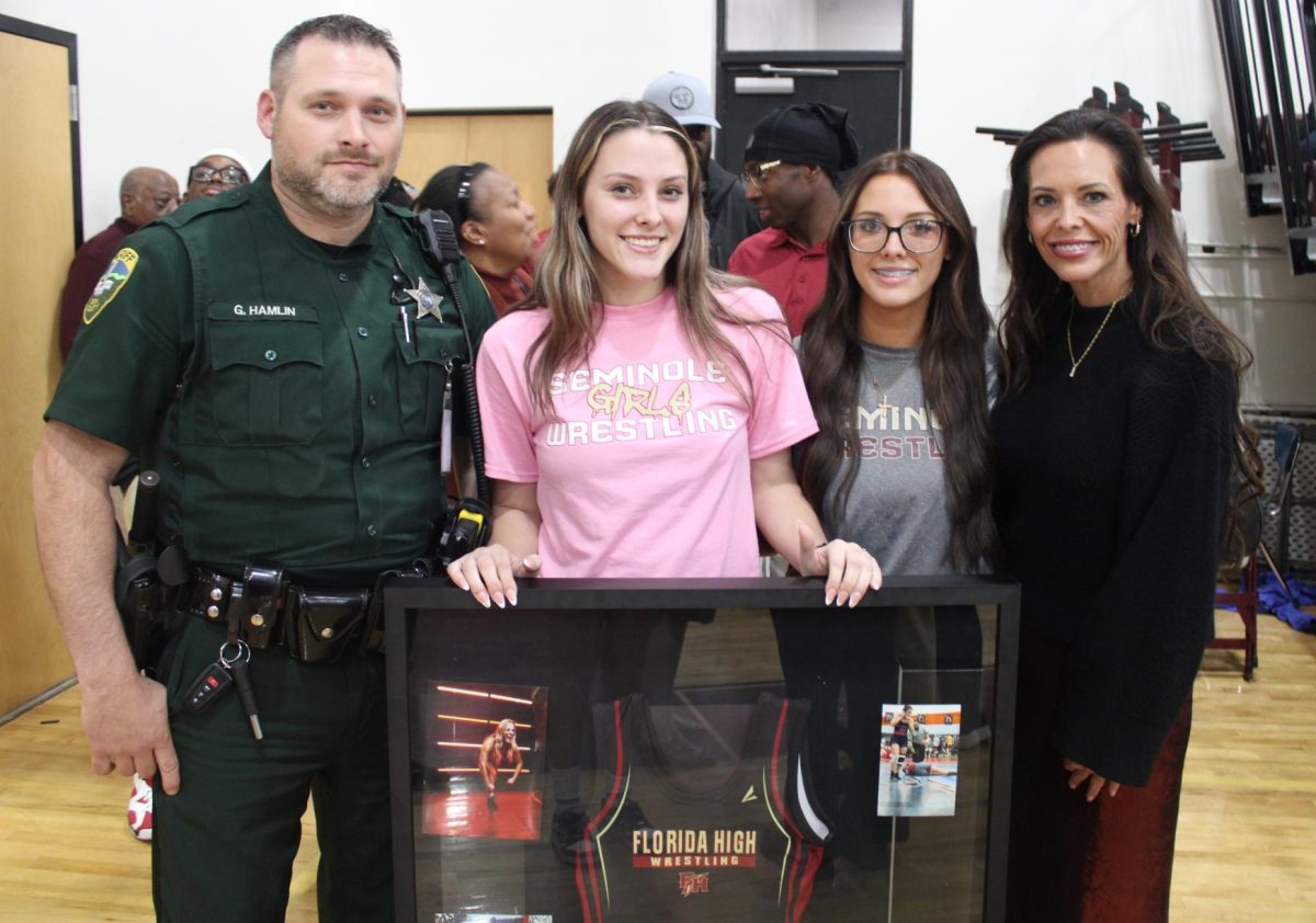 Senior Ashlyn Hamlin (second from left) poses with her father Garrett Hamlin, sister Bailey Hamlin and mother Heather Hamlin (left to right) on her Senior night