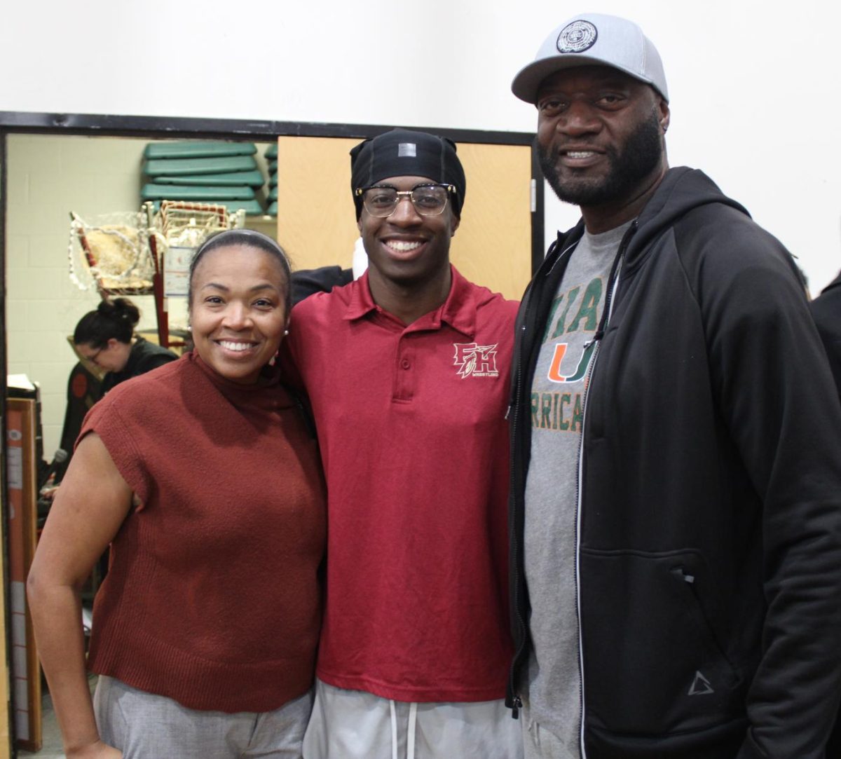 Senior wrestler Sterling Hollingsworth is supported by his mom Anitra Highland and father Sterling Hollingsworth at his Senior Night.