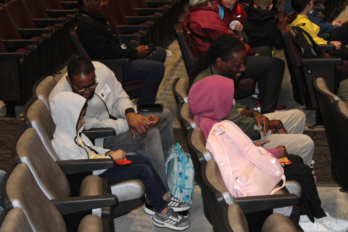 Patience took center court at the February All Pro Dads meeting. Fathers opened the event by talking with their children and sharing something they were proud of.