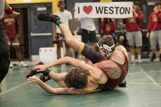 Seventh grader Weston Middleton battles trhough a tough match on the wrestling mat, competing against older opponents. He stays locked in and determined as the match unfolds, showing a poise beyond his age.
Photo courtesy of Weston Middleton.