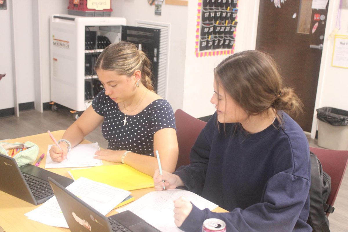 Sophomore Paula Llado Prat (left) works along with junior Mabry Garrison (right) in Algebra 2. Being an exchange student has opened up new opportunities for Llado Prat.