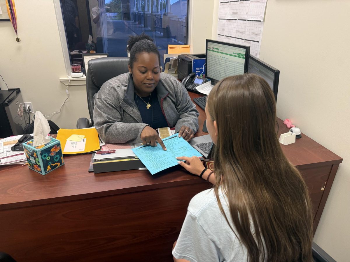 Academic Dean April McGriff talks about classes with sophomore Madison Platt. Choosing the right courses will put a student on the best path toward their goals.