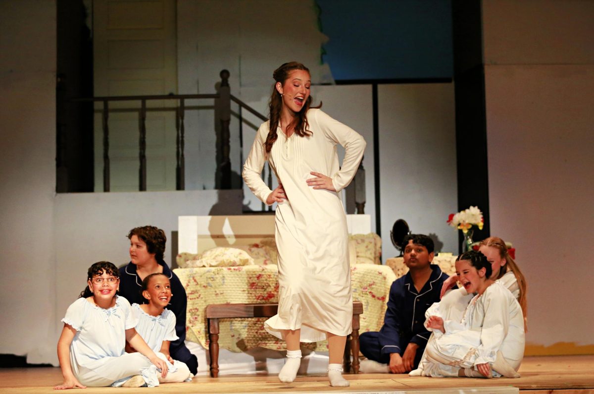 Senior Brooke Baum played Maria in the musical. Here, she sings with the cast composed of elementary, middle and high school students who played the Von Trapp children.
Photo courtesy of Lorelei Patronis.