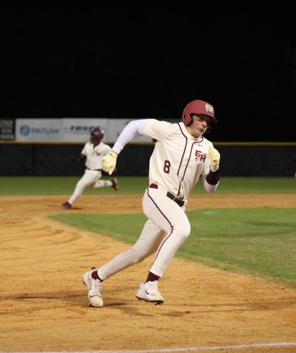 Senior Nick Steibly rounds third base and heads toward home. Steibly has been a consistent leader on the field for the varsity baseball team.
Photo courtesy of The Renegade.